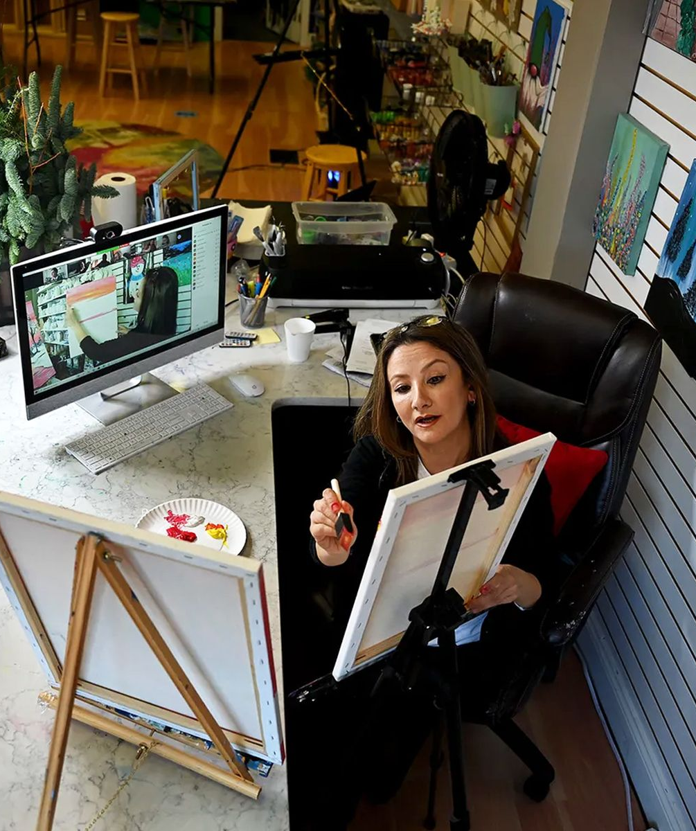 woman painting on canvas