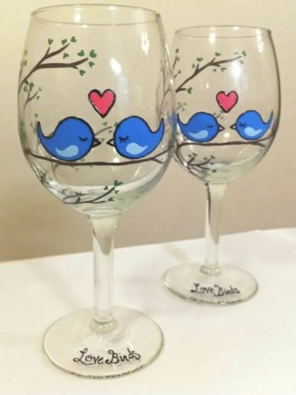 Love birds painted on wine glass