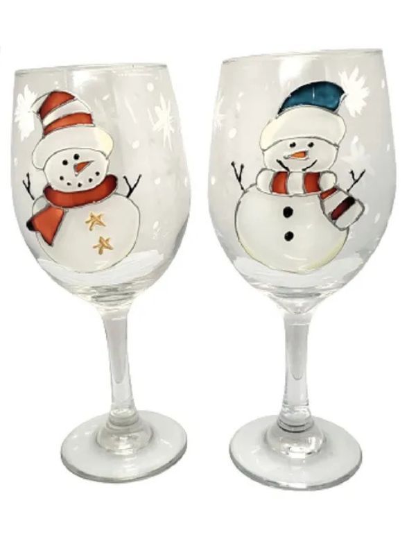 Snowmen painted on wine glasses