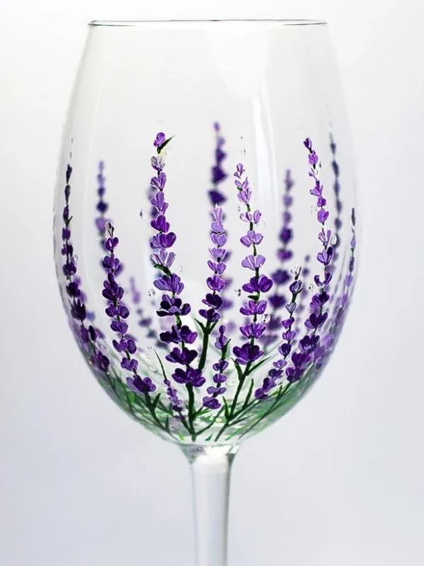 Purple flowers painted on wine glass
