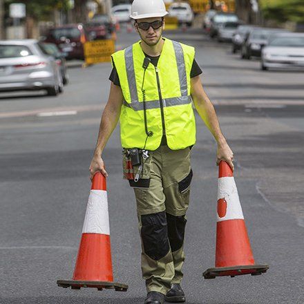 mildura traffic management a man carrying two parking cones