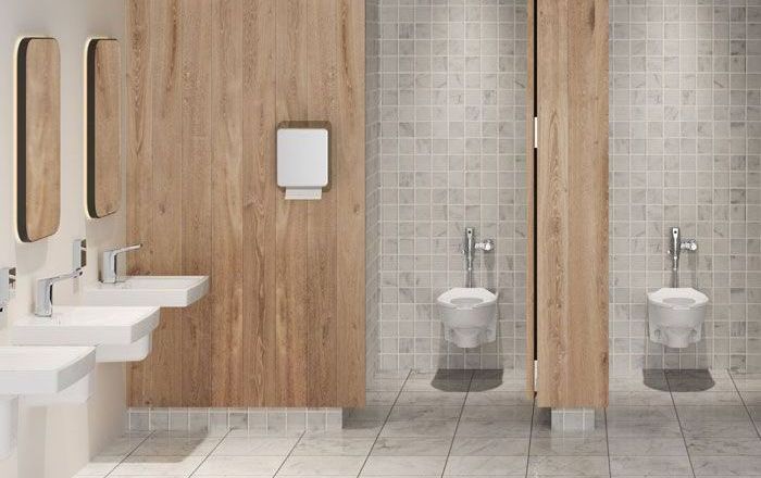 a public restroom with wooden walls, sinks, and toilets
