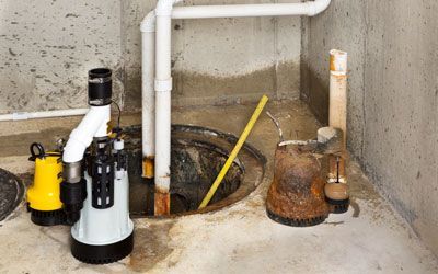 a large pipe is connected to a sump pump