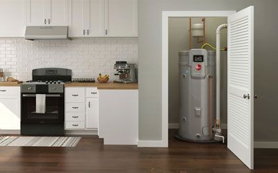 a kitchen with a stove and a water heater in a closet