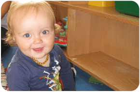 A little girl playing in the classroom