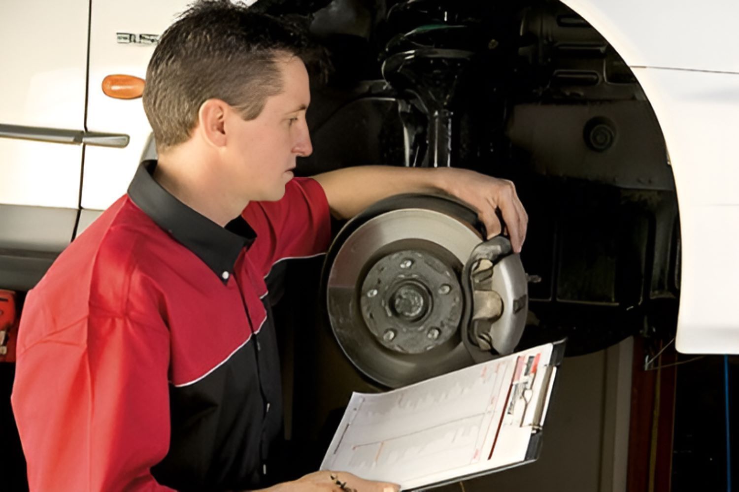 A Man Is Working on A Car — Wayne's Mechanical World in Pialba, QLD