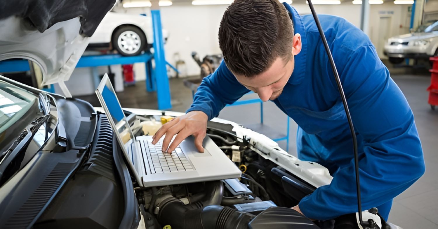 A Man Is Inspecting a Car — Wayne's Mechanical World in Pialba, QLD