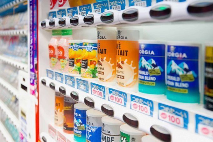 A vending machine filled with a variety of drinks.