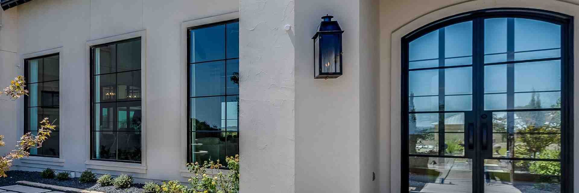 welcoming front porch with a new steel door and updated house numbers - increase property value