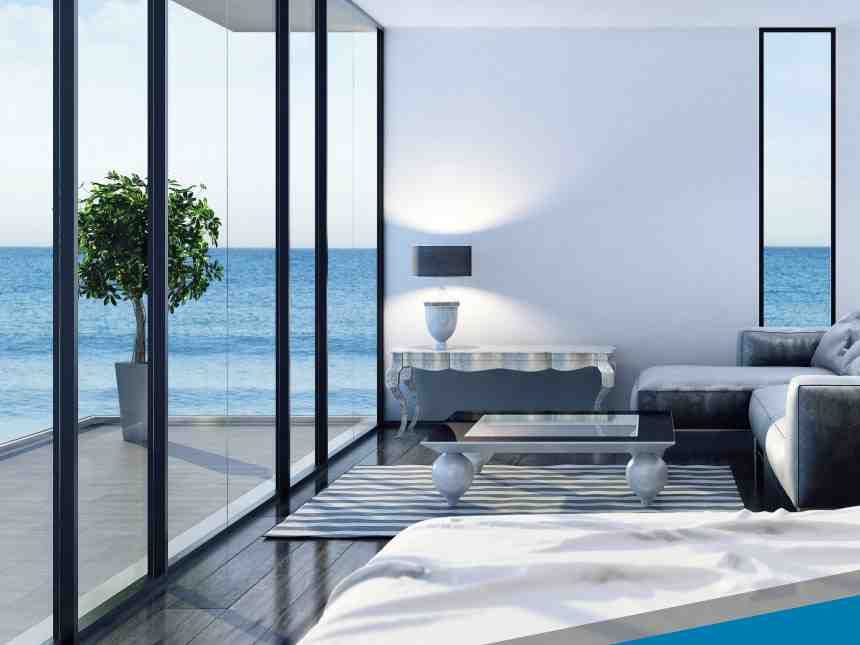 professional installer carefully applying film to a large residential window - window tint to reduce glare