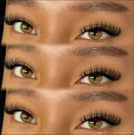 A close up of a woman 's eyes with long eyelashes
