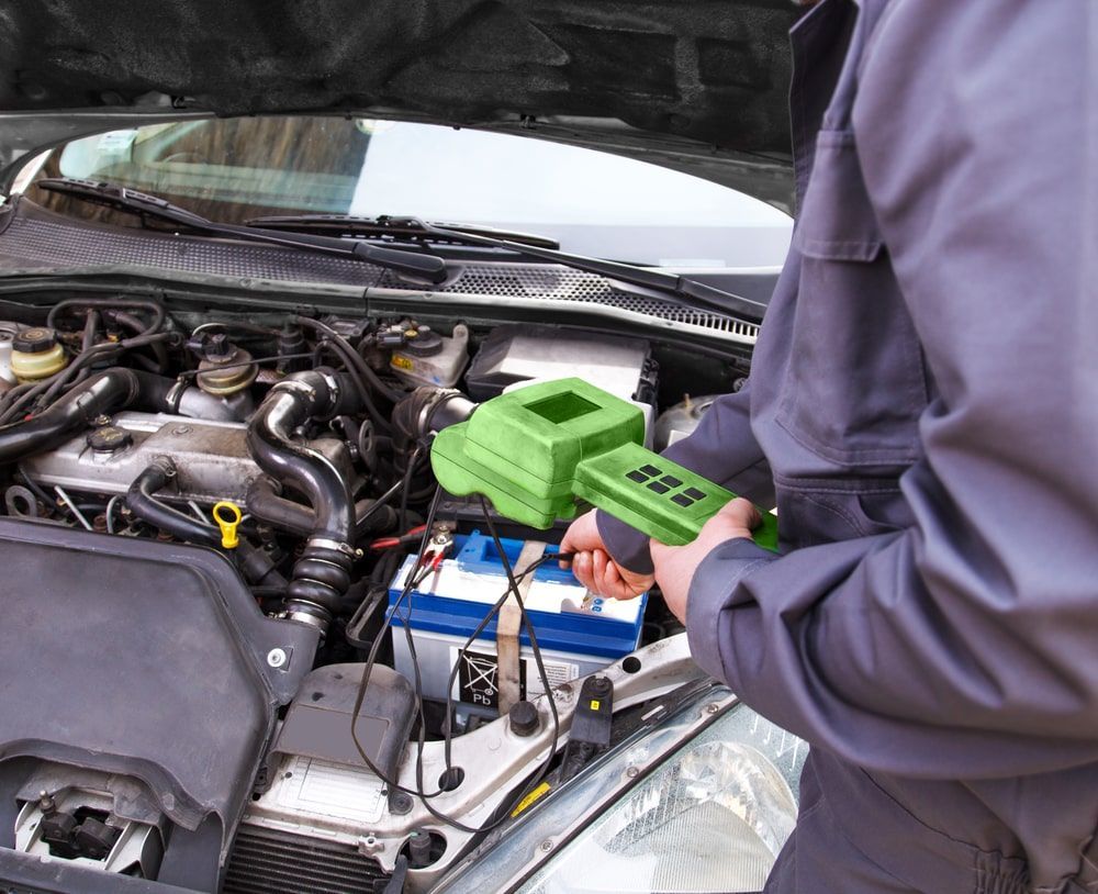 A Man Is Working On The Engine Of A Car β Auto Elect In Parramatta Park, QLD