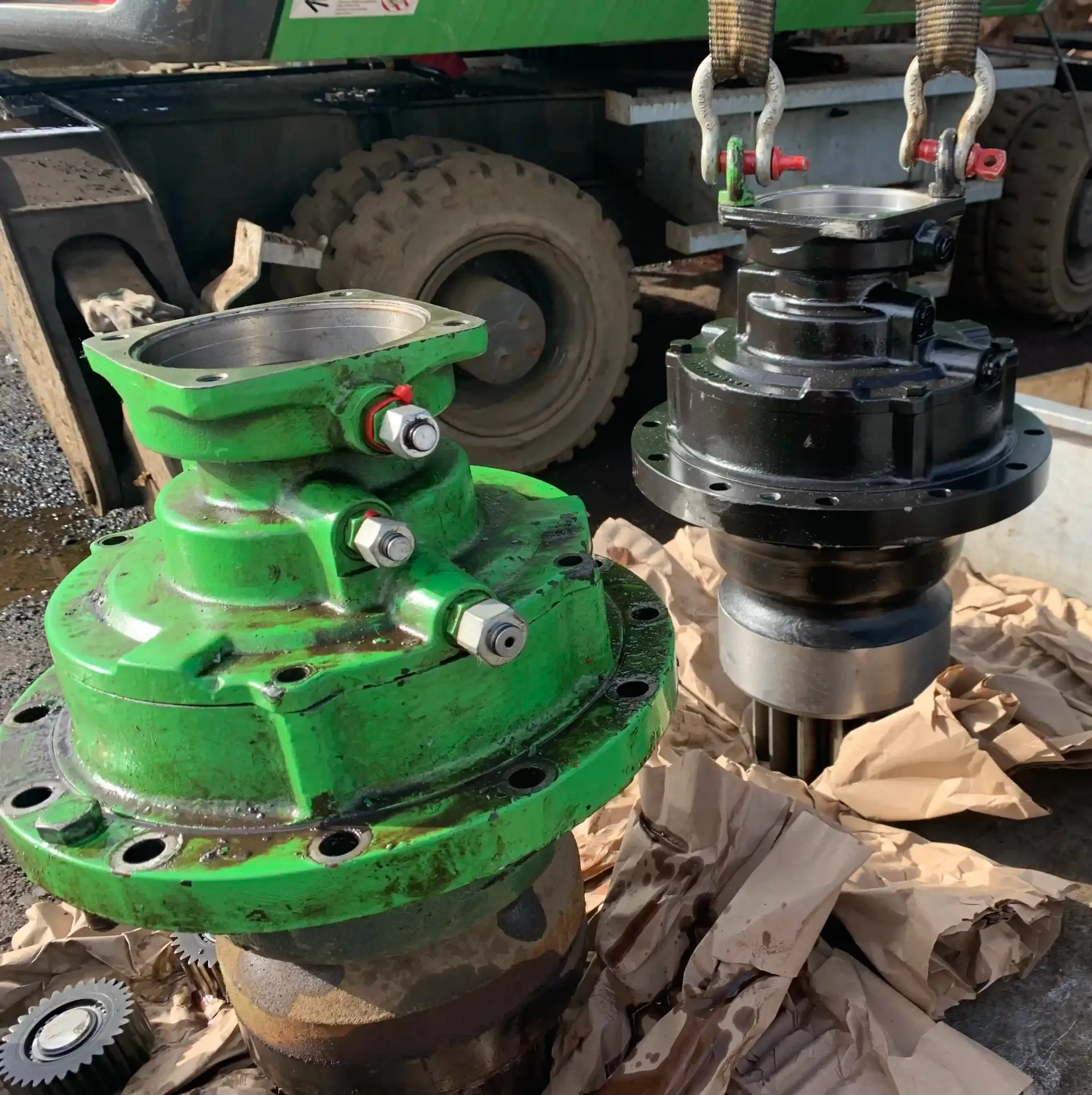 A green and black machine is sitting on a pile of paper