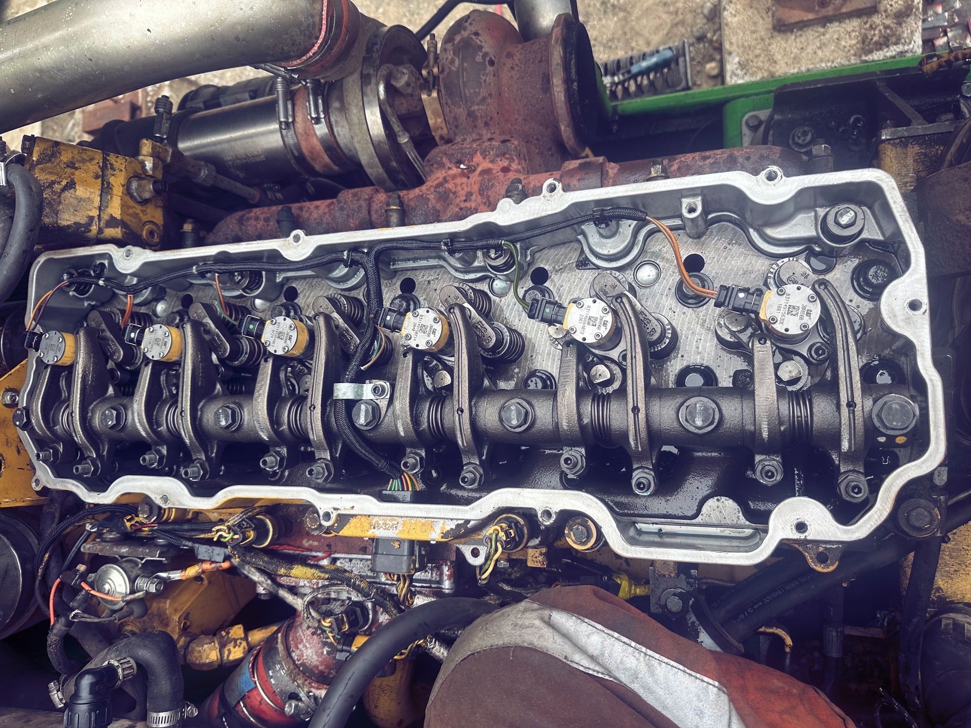 A close up of a cylinder head of a diesel engine