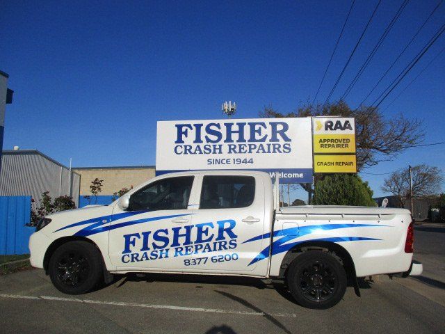 fisher crash repairs truck and sign