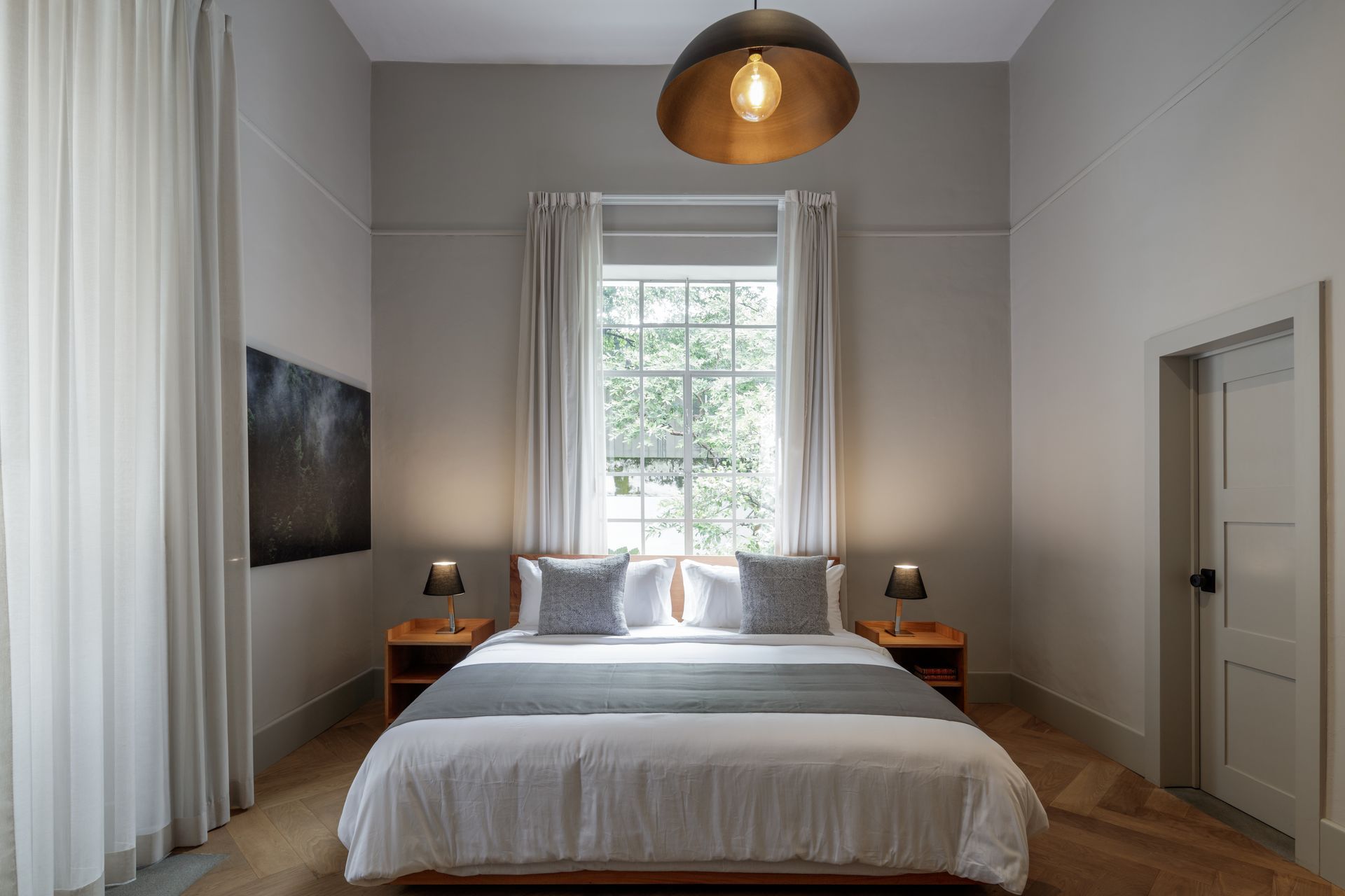 There is a large bed in the middle of the room.