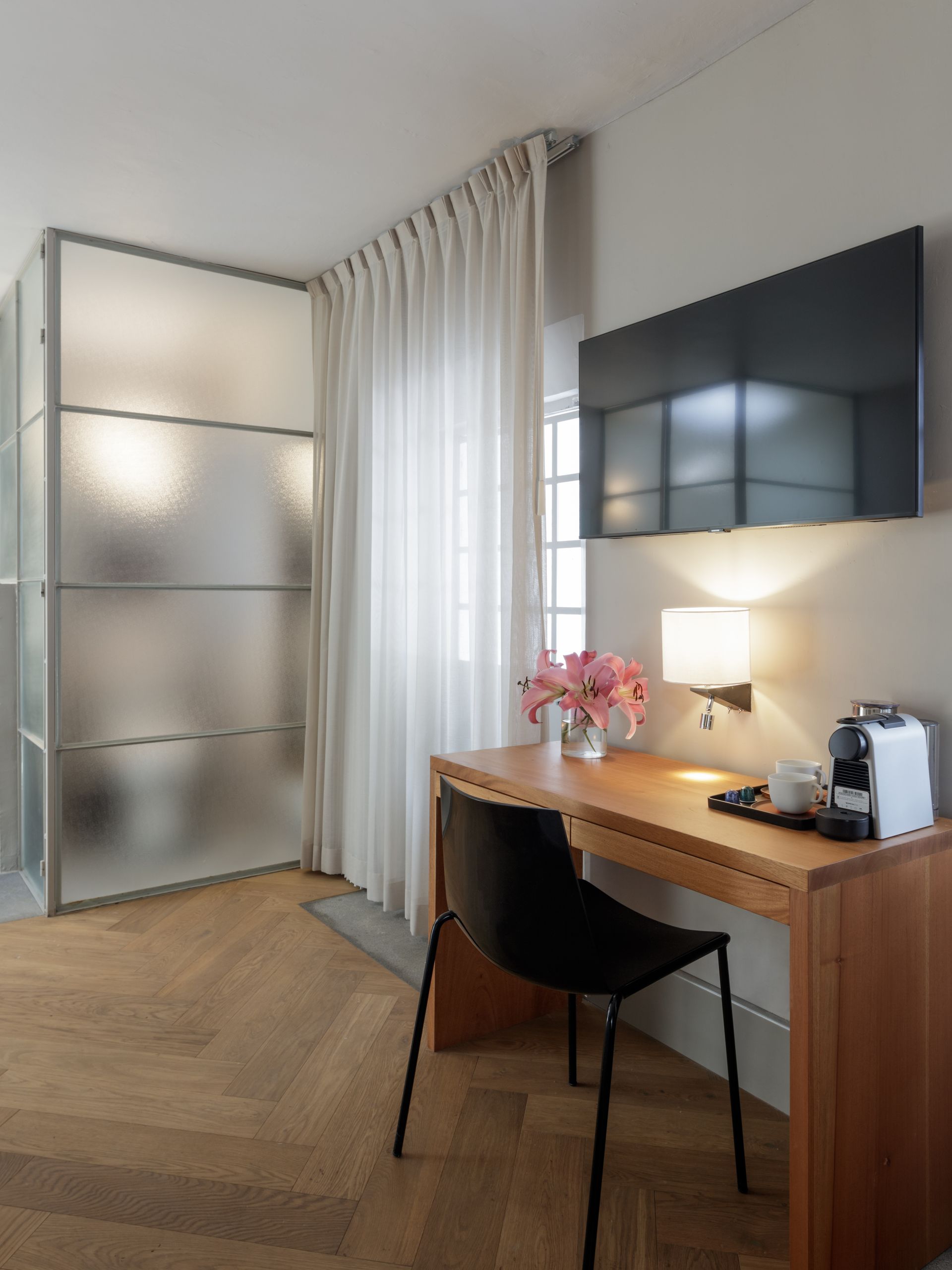 A room with a desk and a chair in it