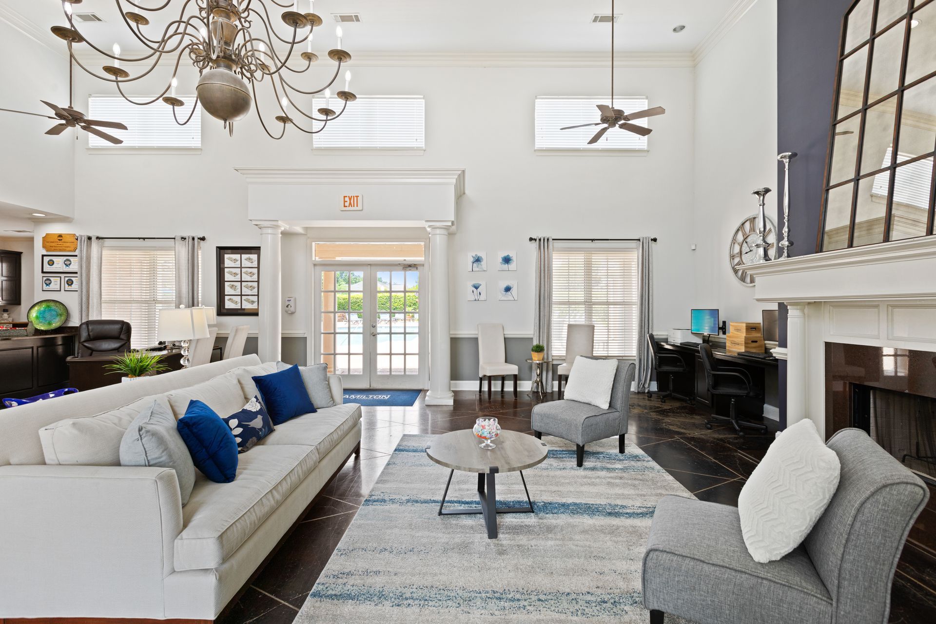 A living room filled with furniture and a fireplace.