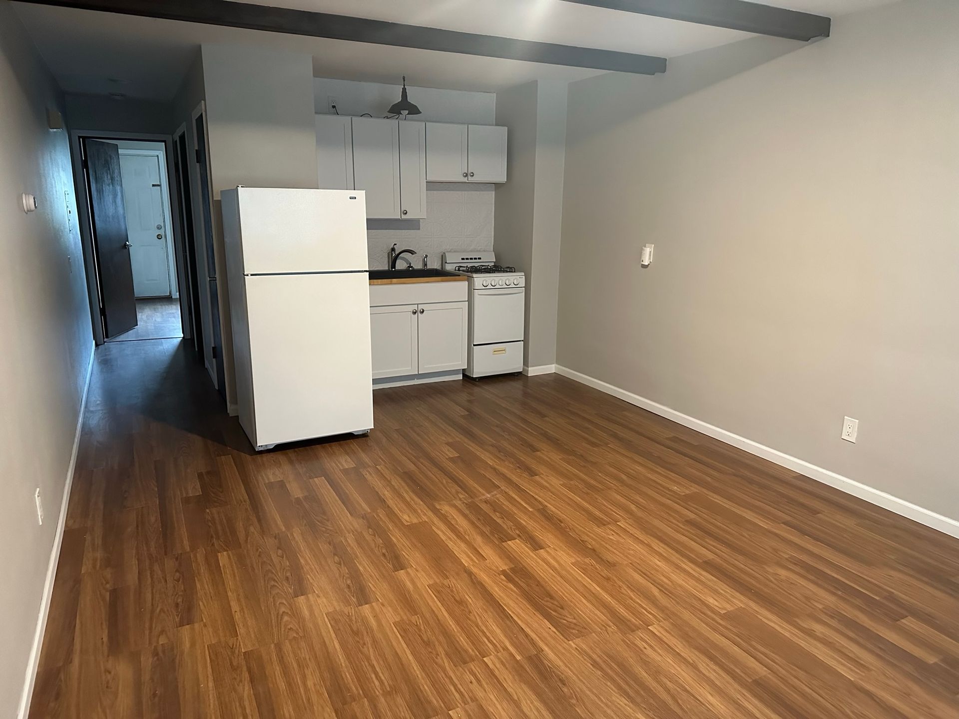 There is a refrigerator in the middle of the room.