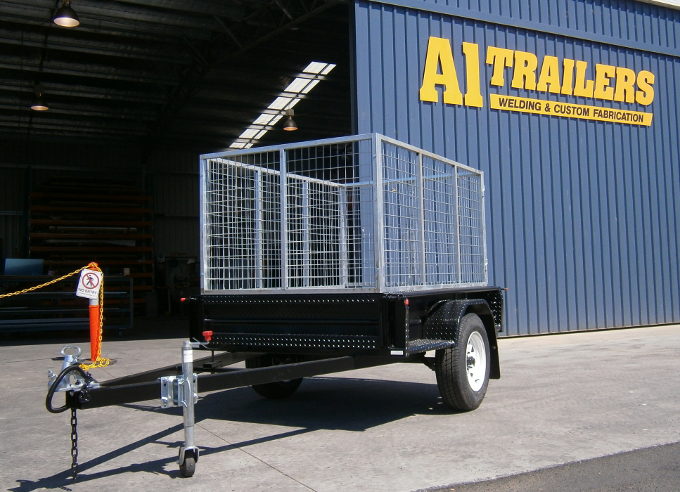 A trailer is parked in front of a trailers building