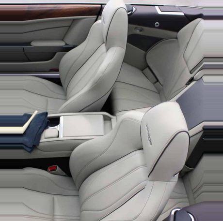 Light grey leather car interior featuring two front bucket seats and wood grain trim on the door panel.