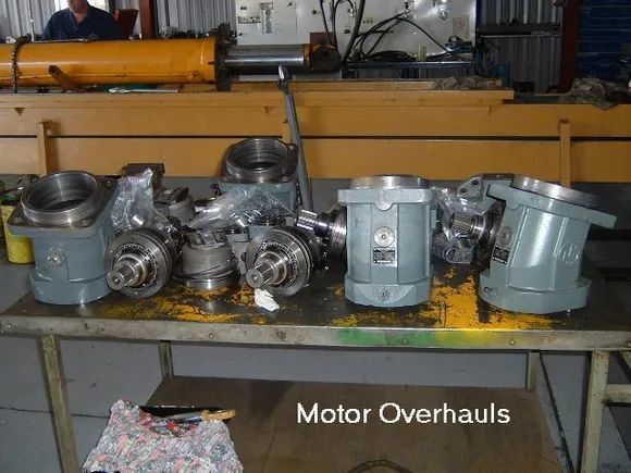 Motor Components Laid Out on a Table for Overhaul — Alloway Hydraulics in Mount Saint John, QLD