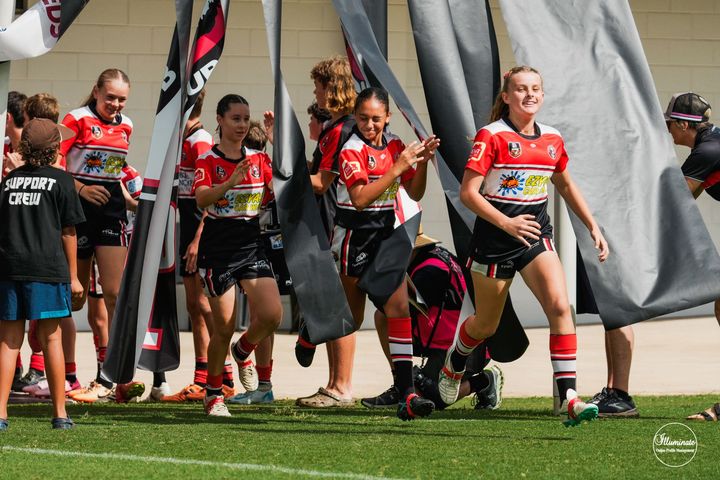 Team photo running onto field - Car Wash in Darwin, NT