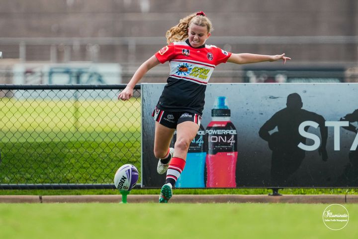 Girl Kicking Rugby Ball - Car Wash in Darwin, NT