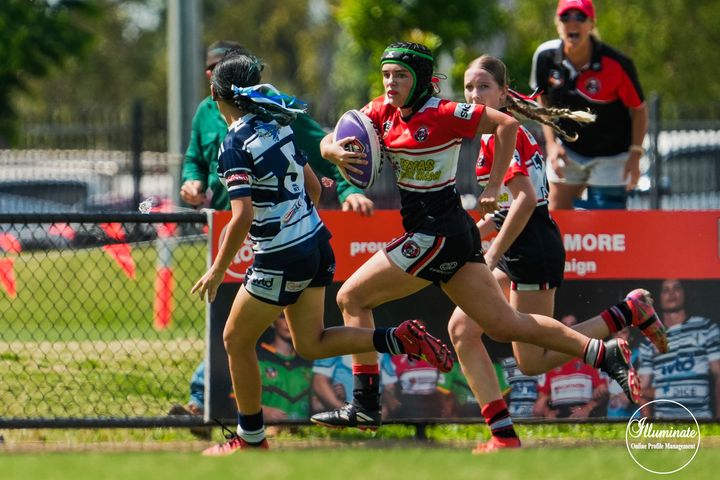 Girl Running in Rugby Game - Car Wash in Darwin, NT