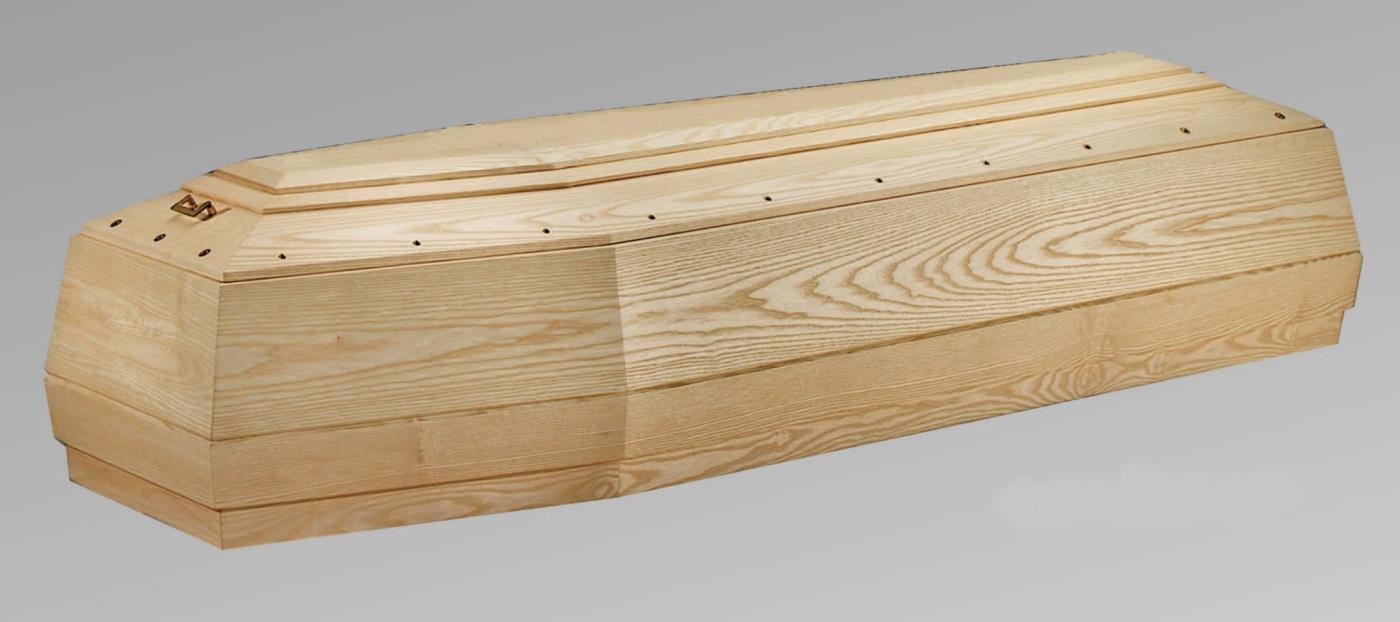 Una bara di legno è appoggiata su una superficie grigia.