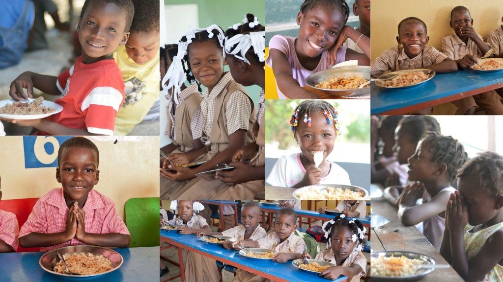 Children eating at a dining hall. Plates of food on tables; happy expressions, various settings, and clothing.