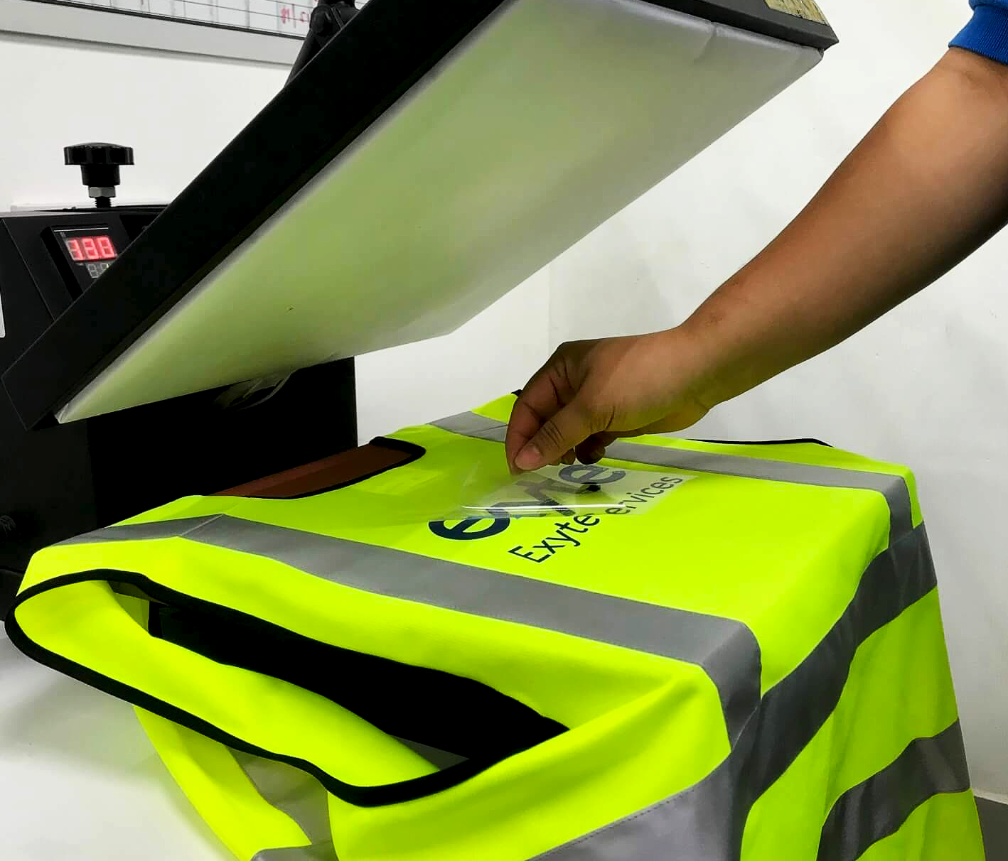 Man Printing On T Shirt In Workshop - Quality Work Uniforms South Nowra, NSW