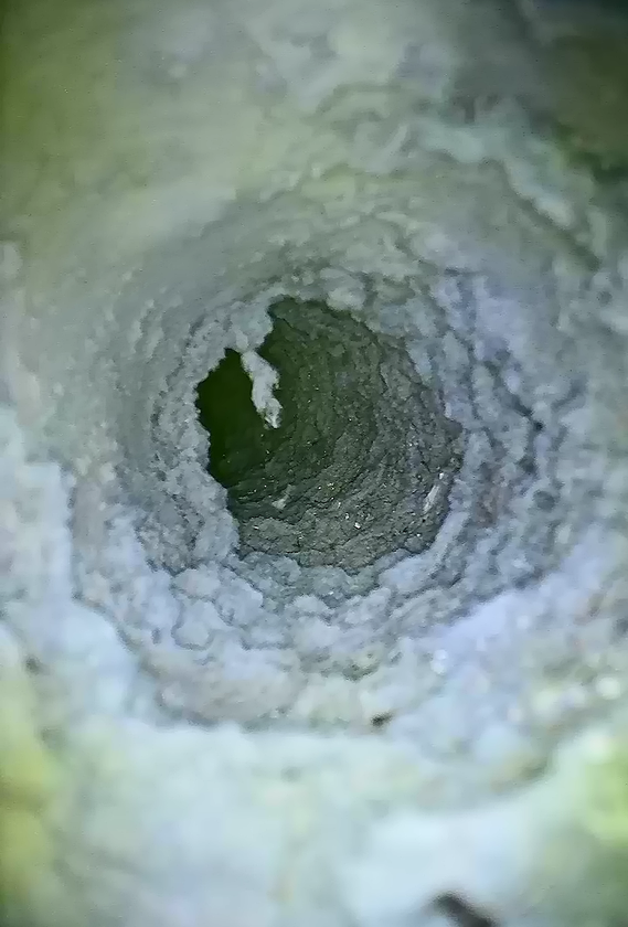 Man Cleaning Dryer Vent In Home — Holmen, WI — Dryer Vent Cleaning Crew