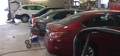 Cars in garage — Auto Body Services in Oneida, NY