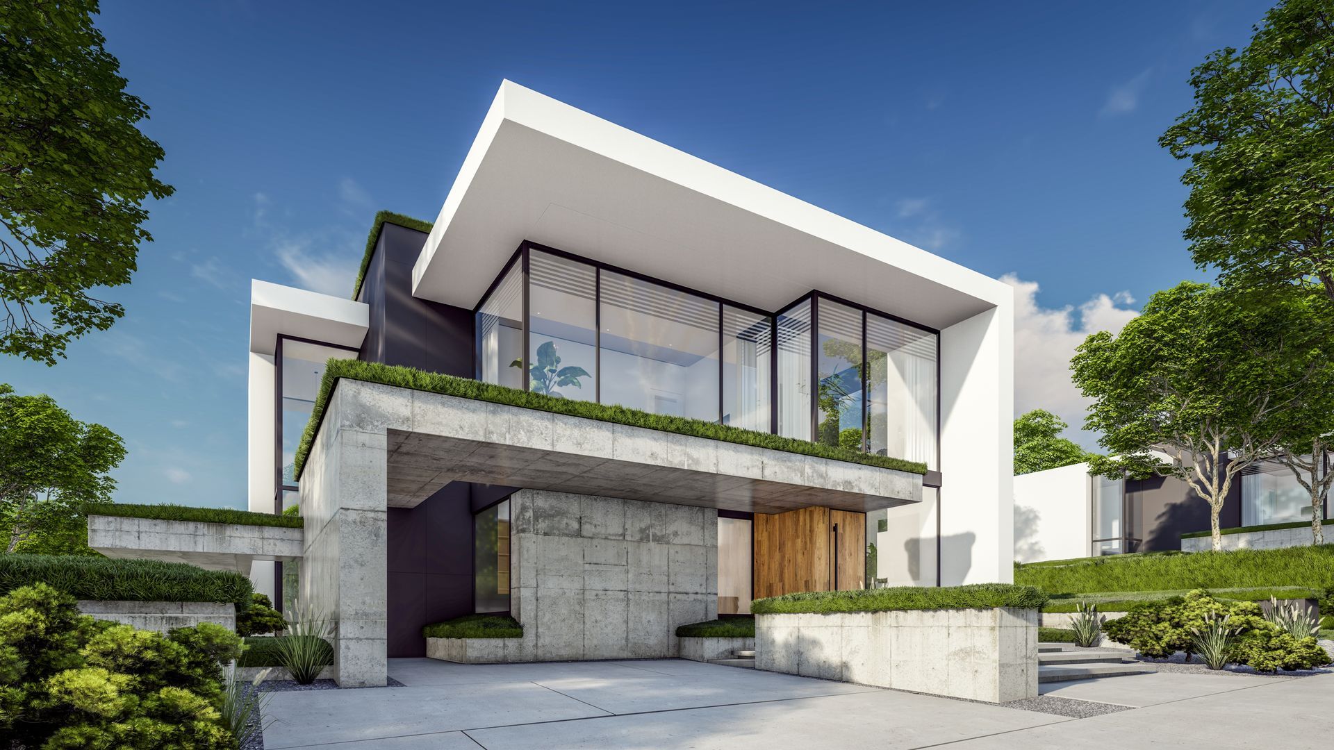 Modern white and concrete house with large windows, greenery, and a blue sky.