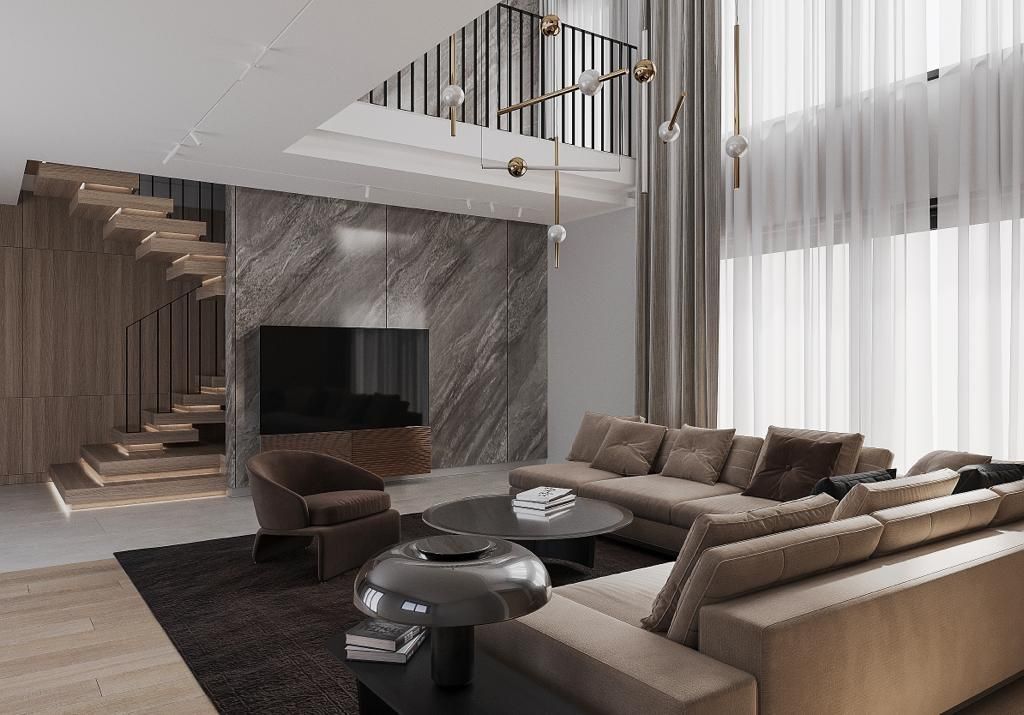 Modern living room with neutral tones, large sectional, and wooden staircase.