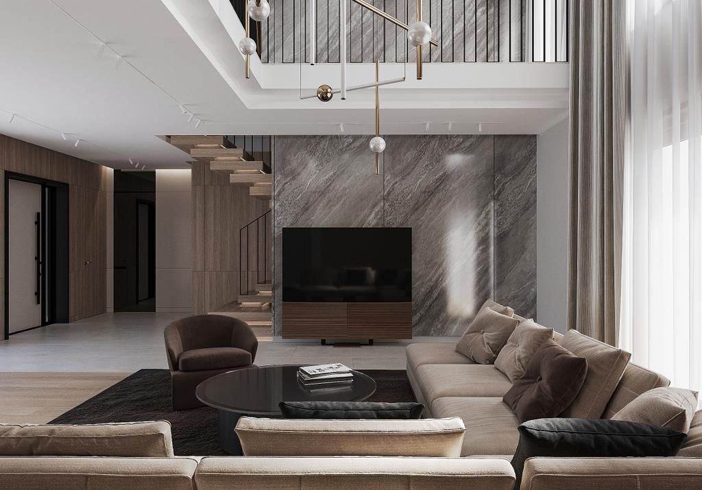 Modern living room with neutral tones, large sectional sofa, TV, and staircase.