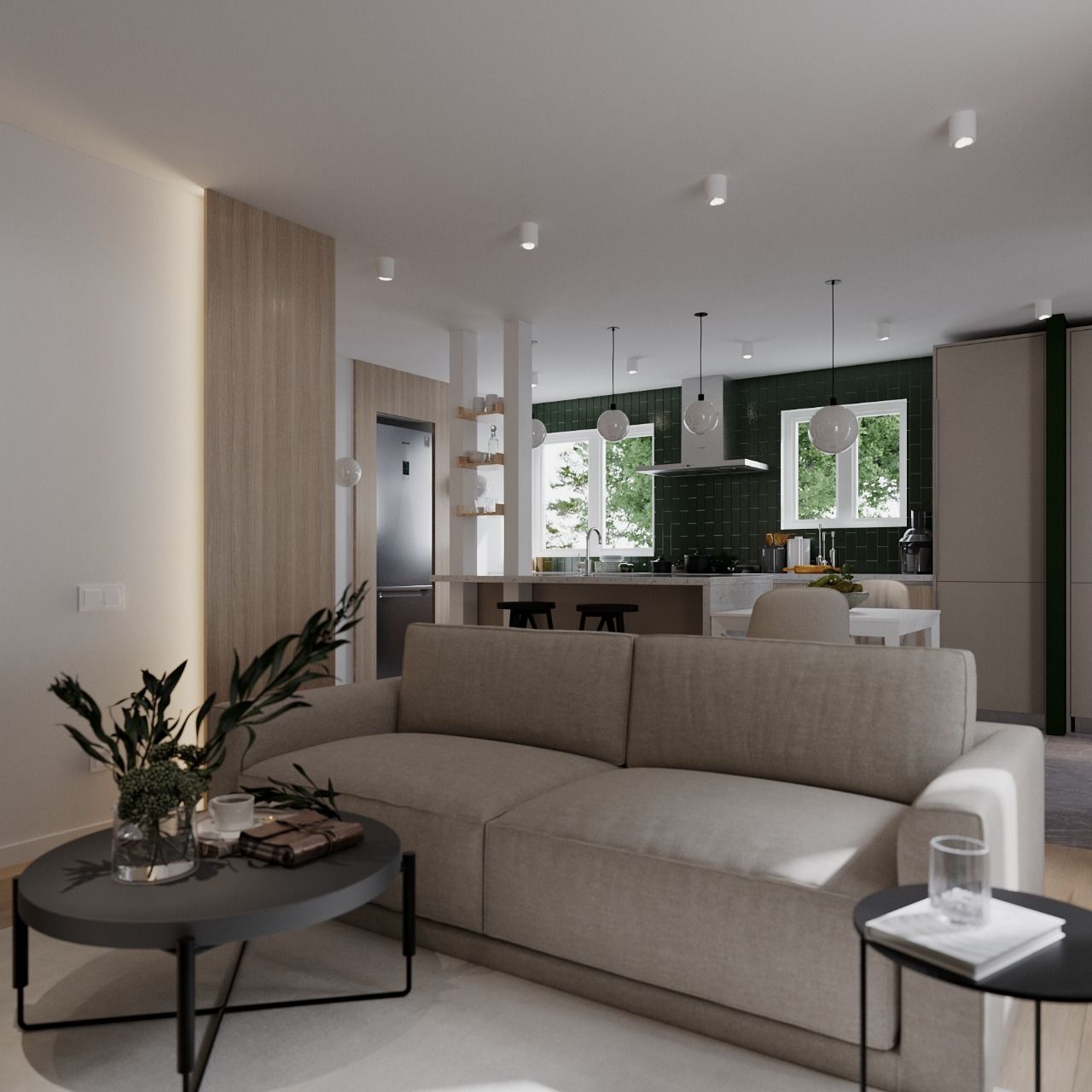 Modern living room with beige sofa, dark coffee table, open to a kitchen.