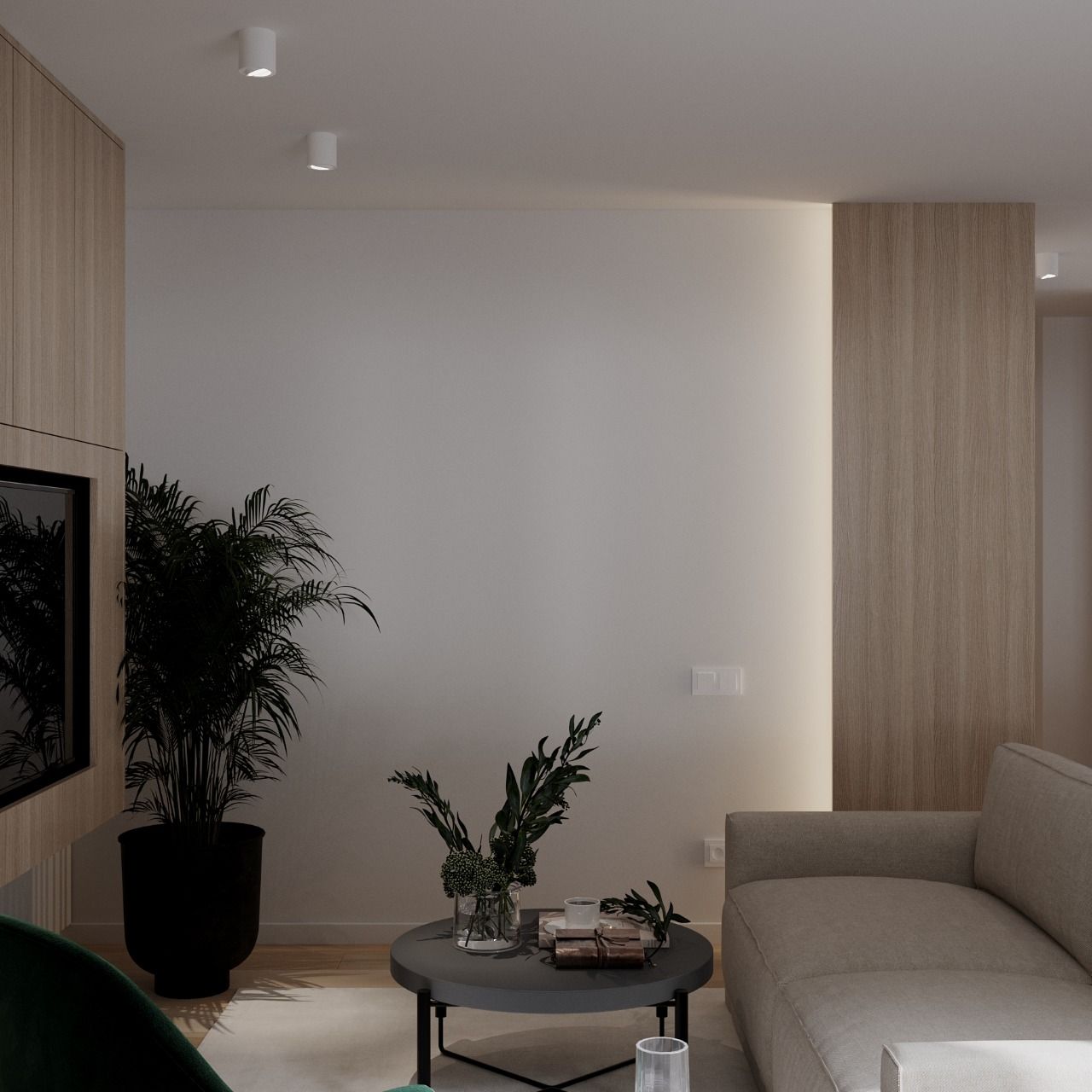 Living room with pale walls, wood paneling, sofa, plants, and a small coffee table.