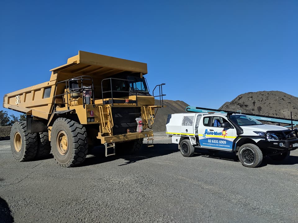 Mining Dump Truck next to Auto Watt Work Ute — Mobile Auto Electrician in Kelso, NSW