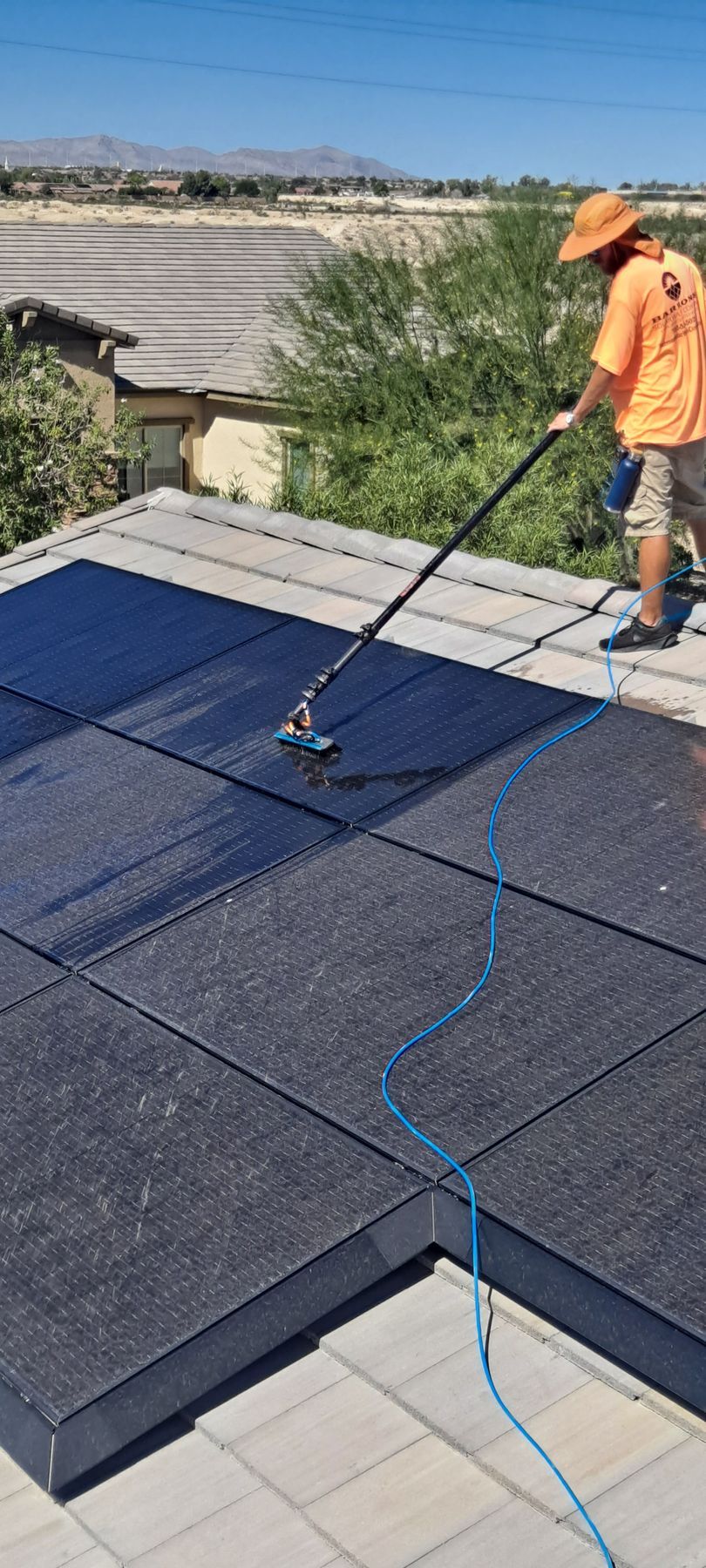 Cleaning dirty solar panels with water-fed poles