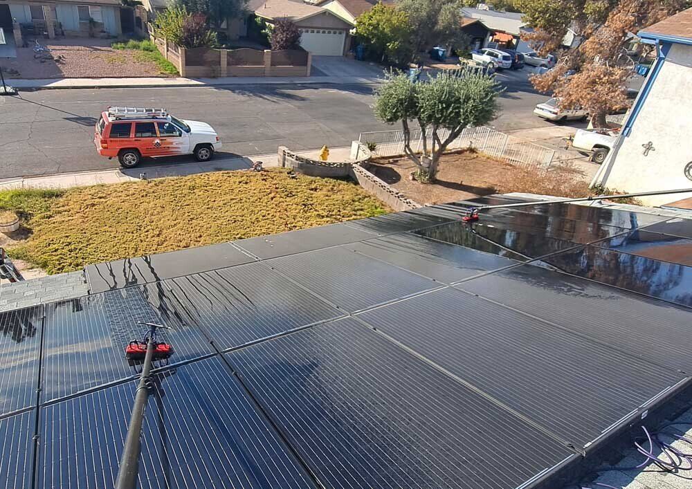 Dirty solar panels in the process of getting cleaned