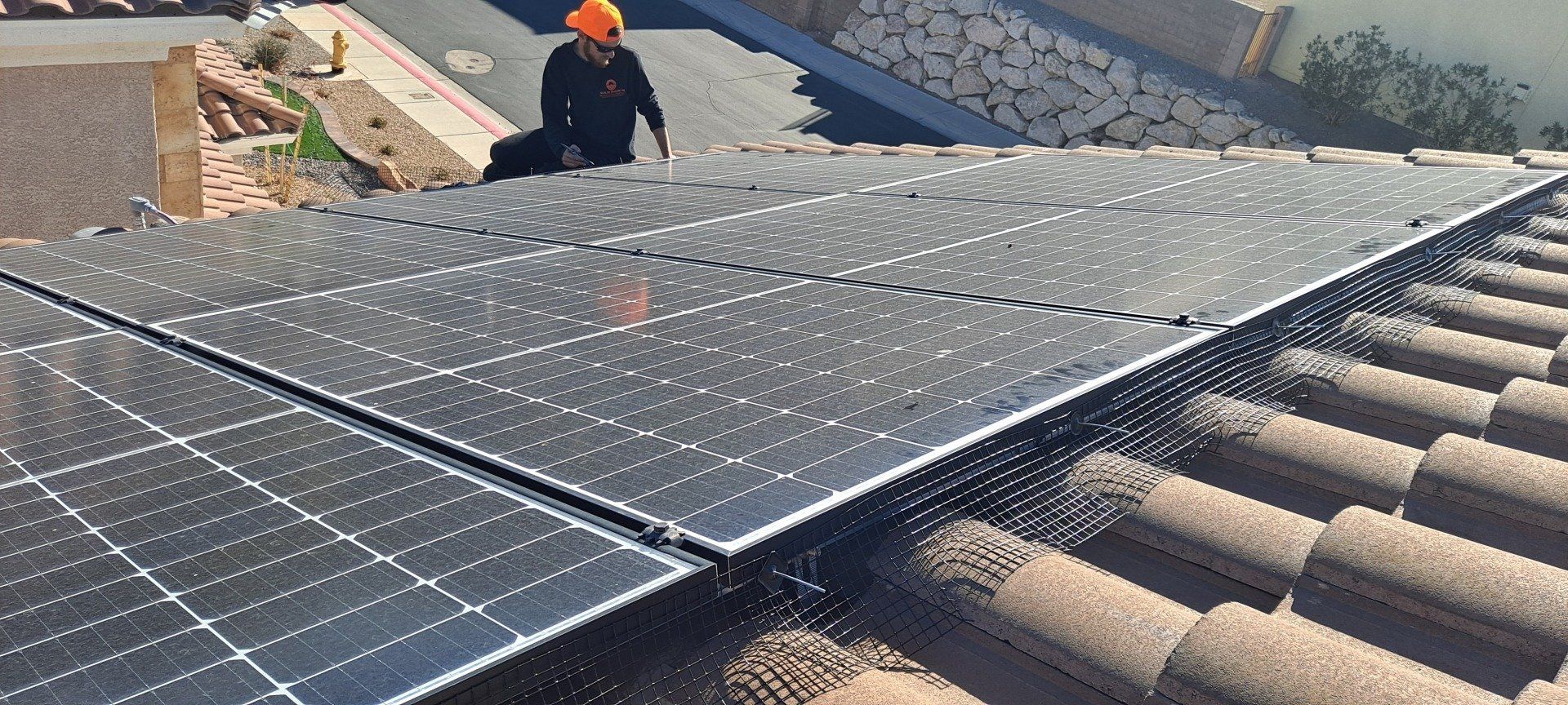 Applying Pigeon guard around solar panels