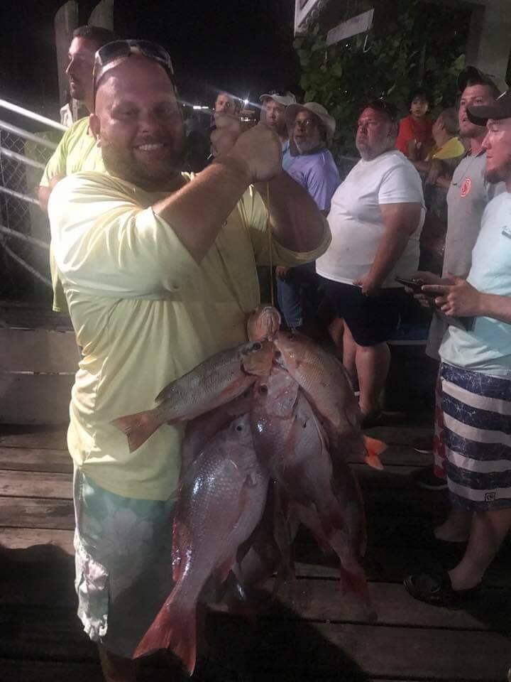 Man with Fishes - Deep Sea Fishing in Tarpon Springs, FL