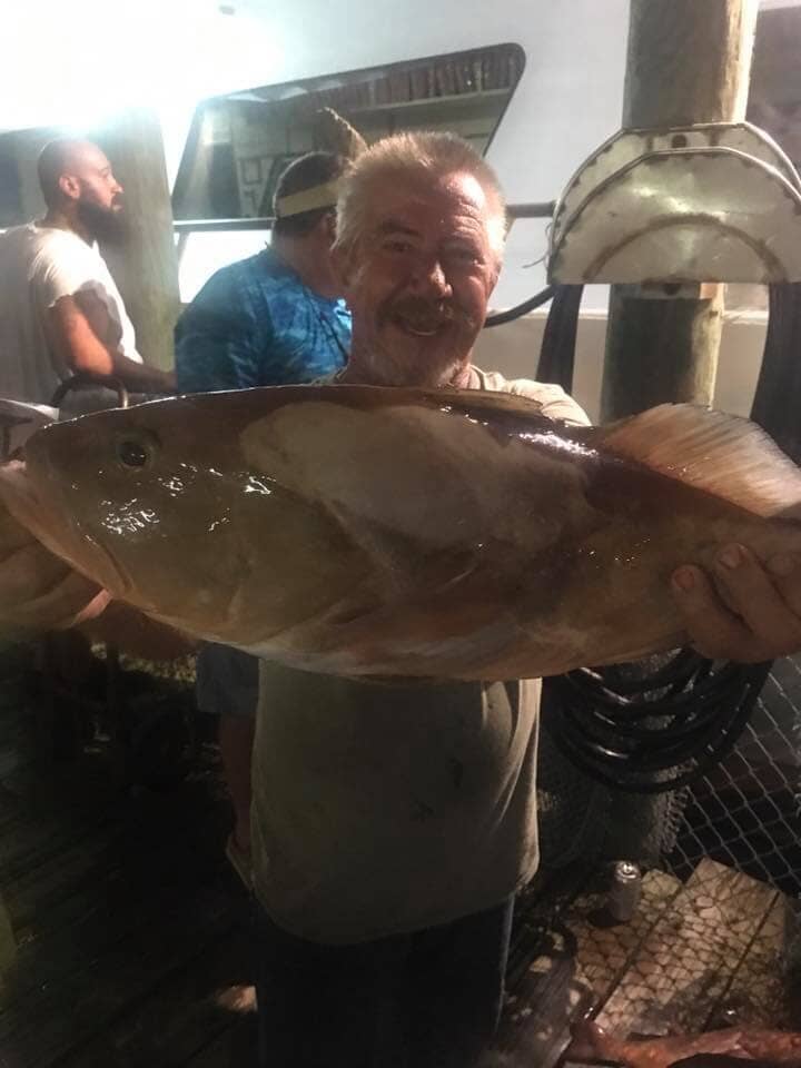 Man with Big Fish - Deep Sea Fishing in Tarpon Springs, FL