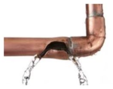 A copper pipe with water coming out of it