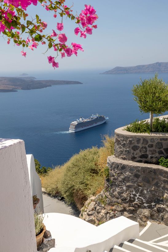 A cruise ship is floating on top of a body of water