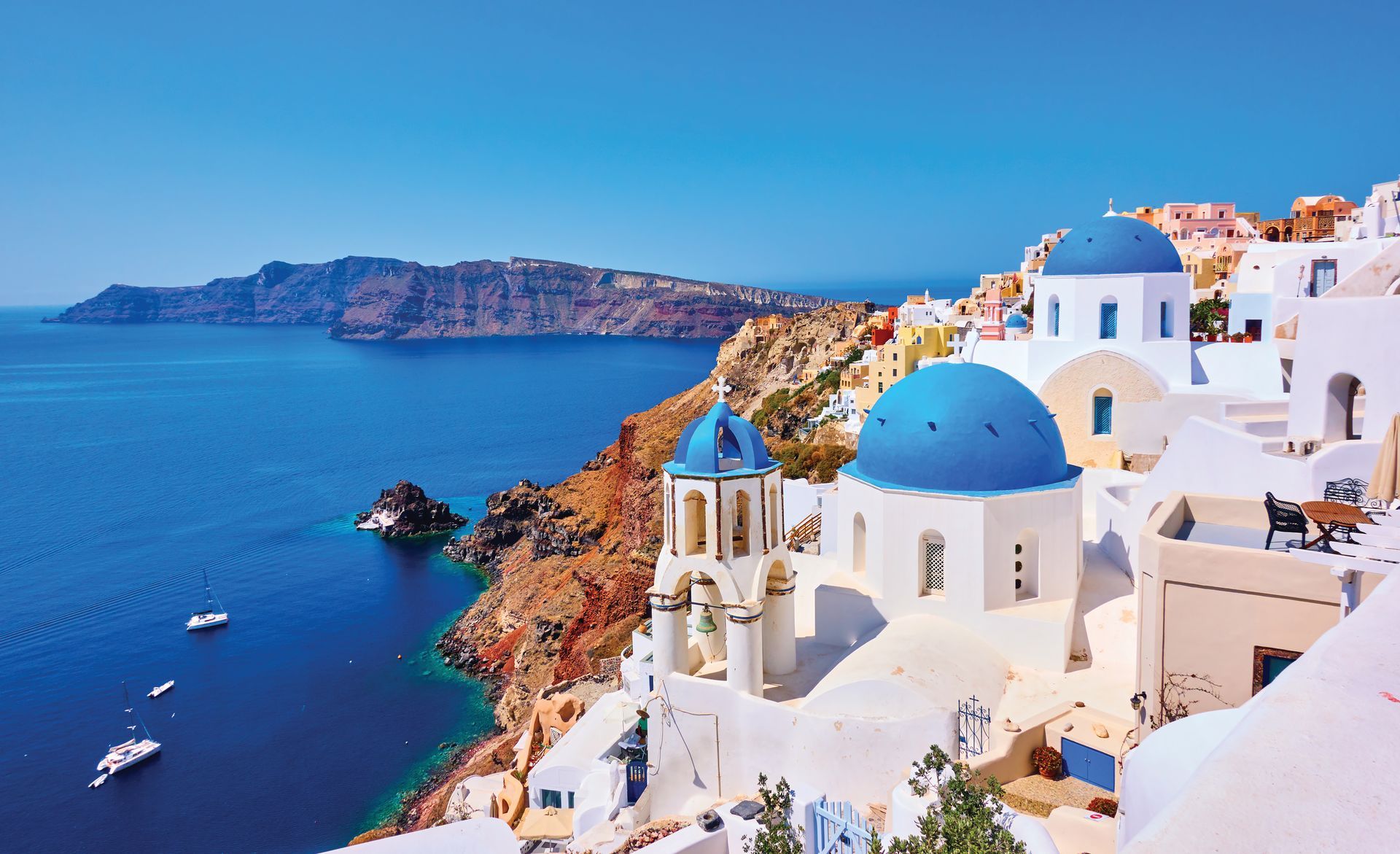 There are a lot of blue domes on the buildings in santorini.