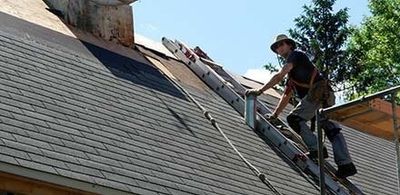 A man providing Roofing Repair in Huntington Beach, CA