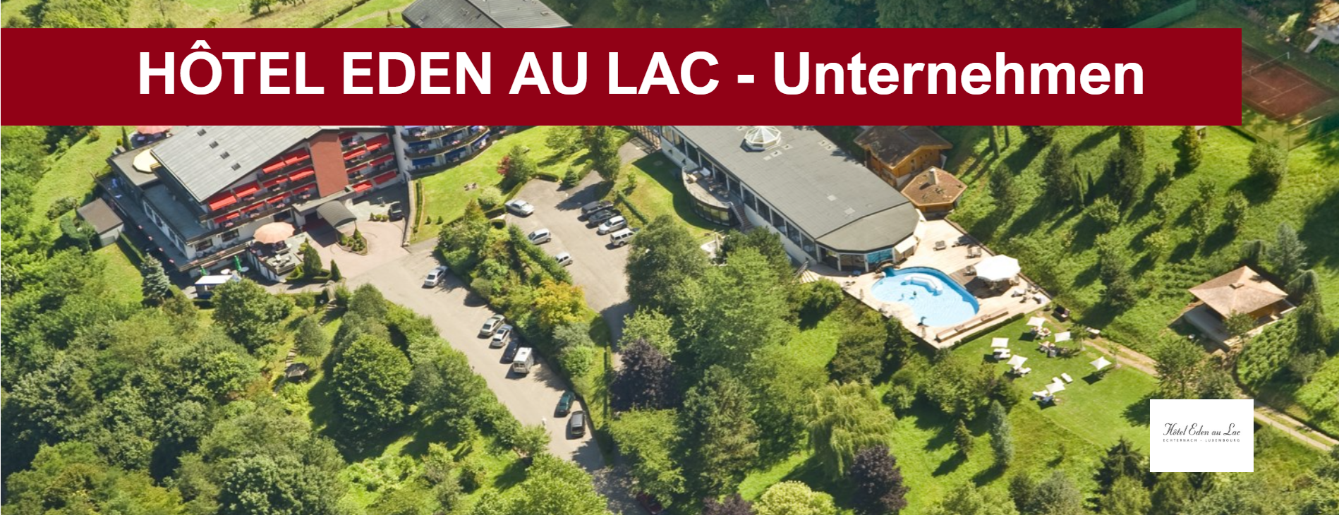 Vue aérienne de l'Hôtel Eden au Lac dans un paysage verdoyant avec piscine.